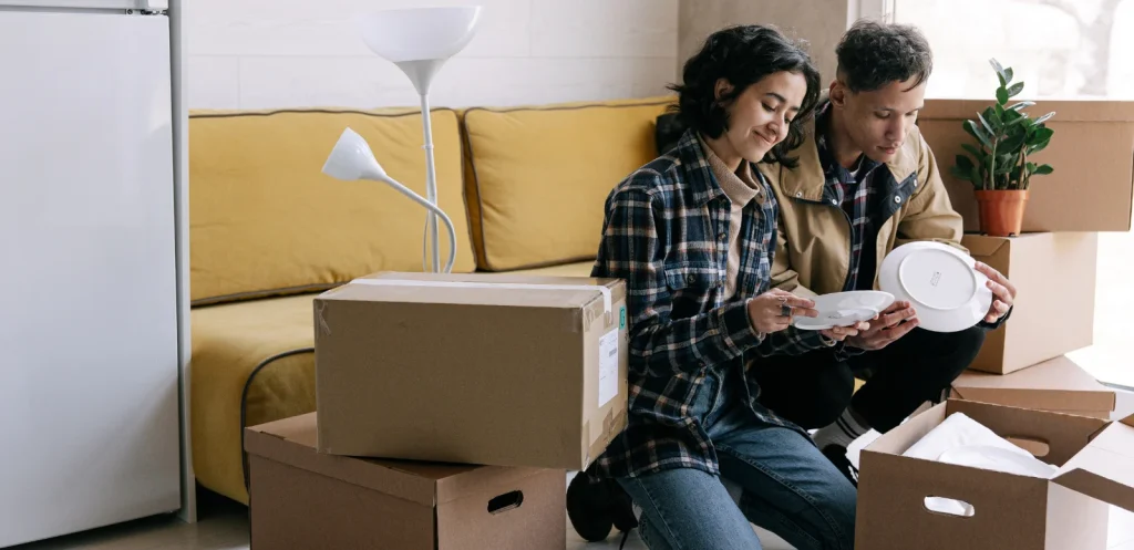 Young couple moving into a house