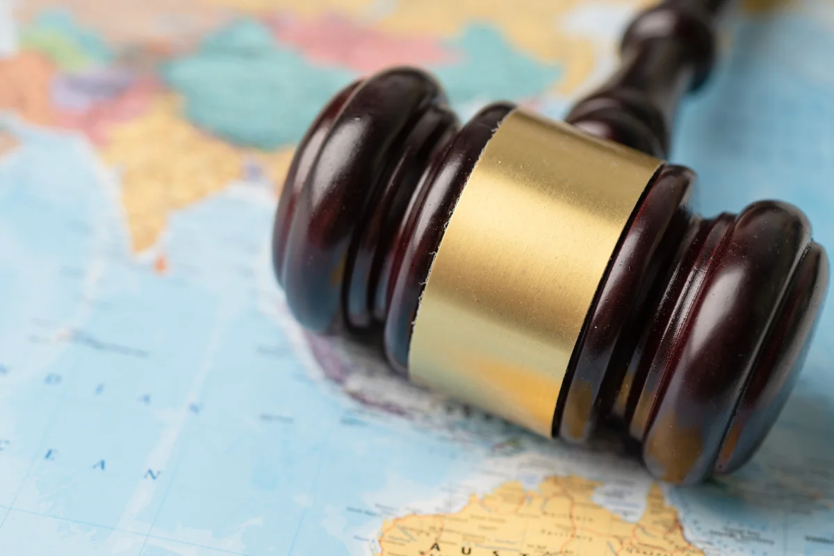 Gavel lying on a world map